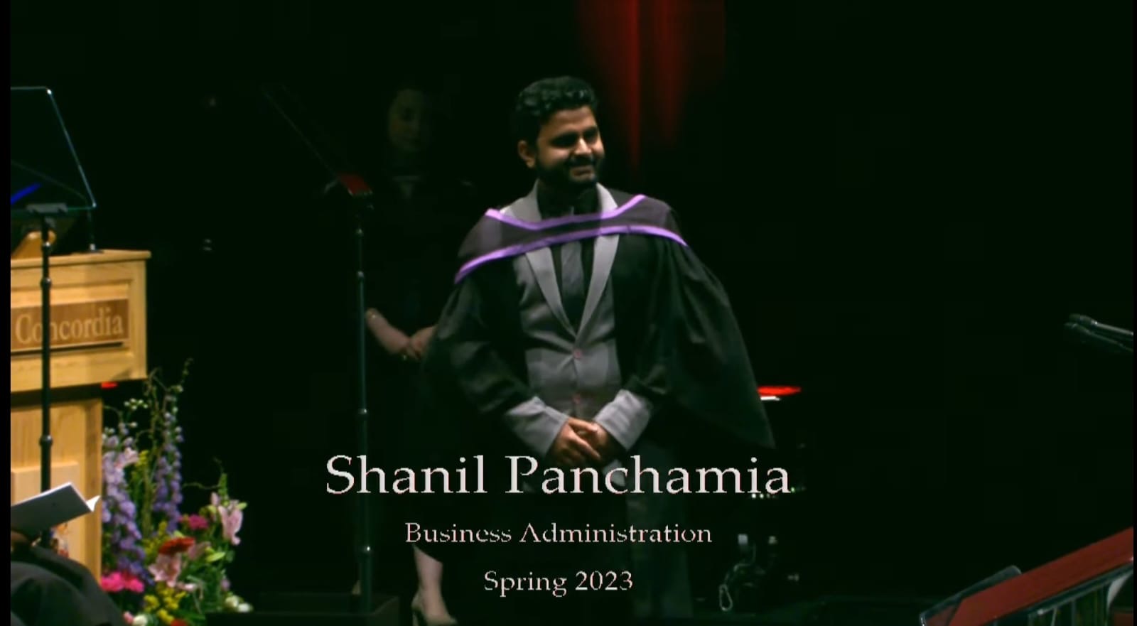 Crossing the stage at Concordia's graduation ceremony, Spring 2023